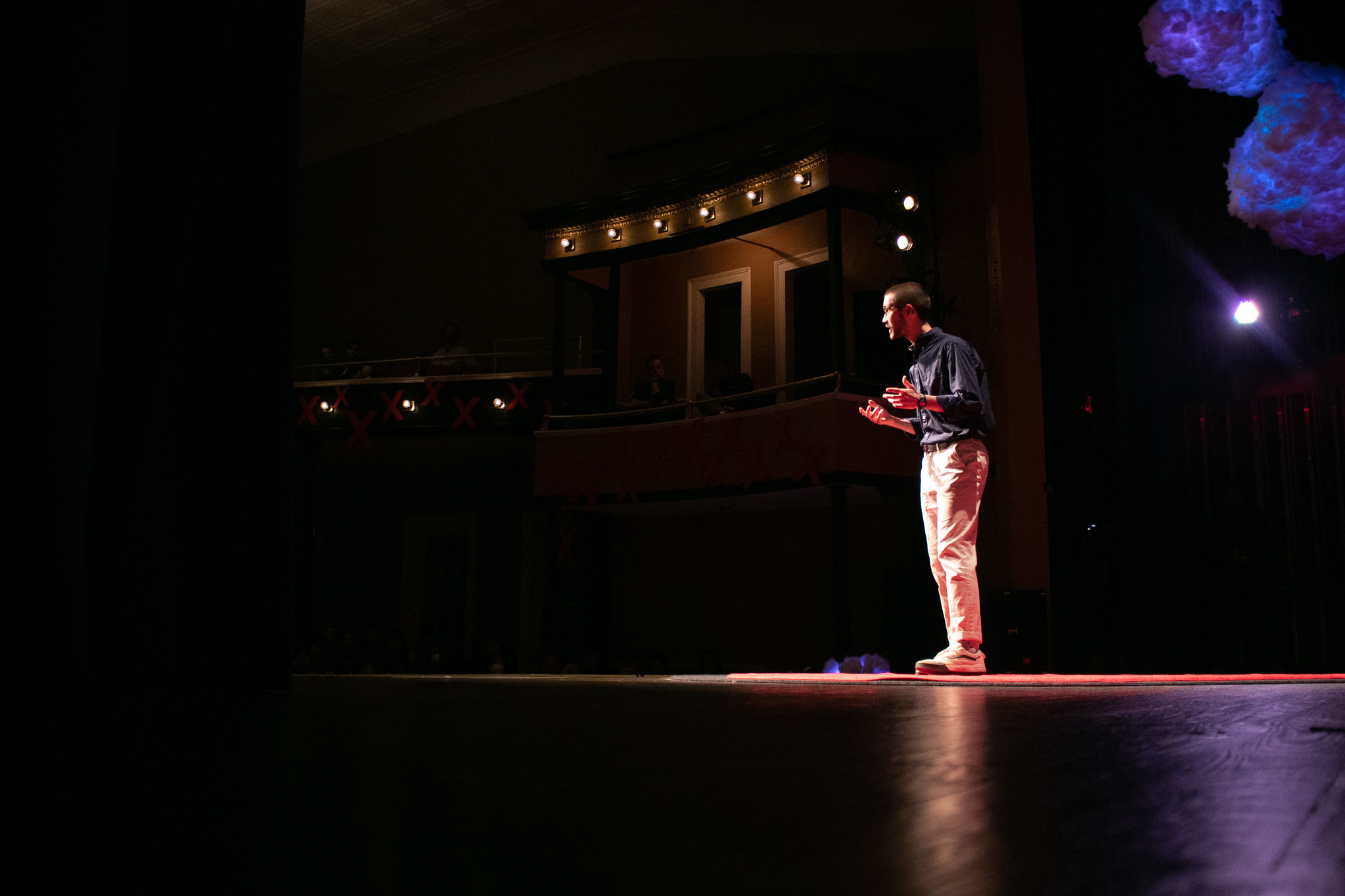 Jack Harth giving a TEDxUGA talk on stage